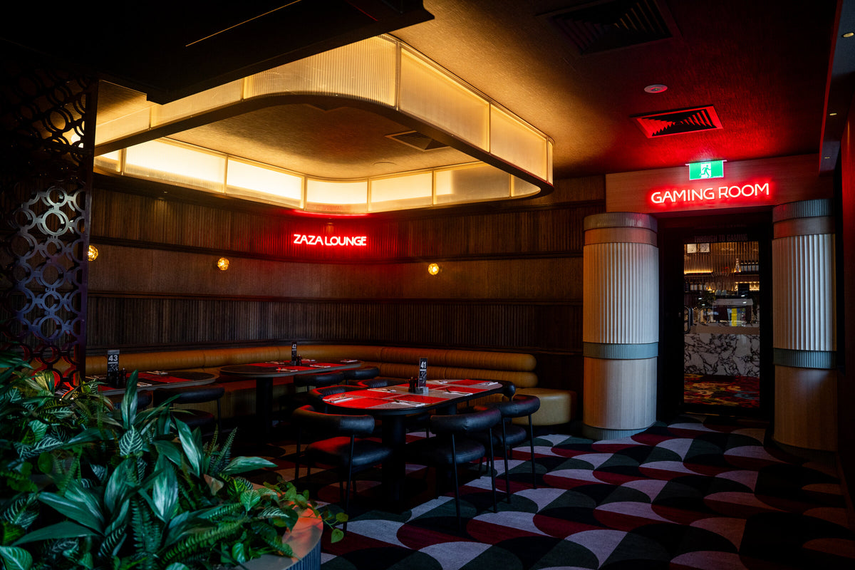 Zaza Lounge and Gaming Room illuminated signage seen together in one room at Richmond Social