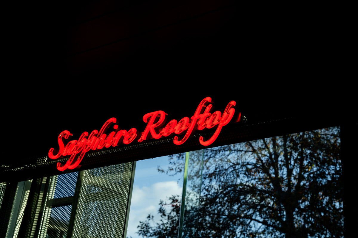 Sapphire Rooftop signage in illuminated script