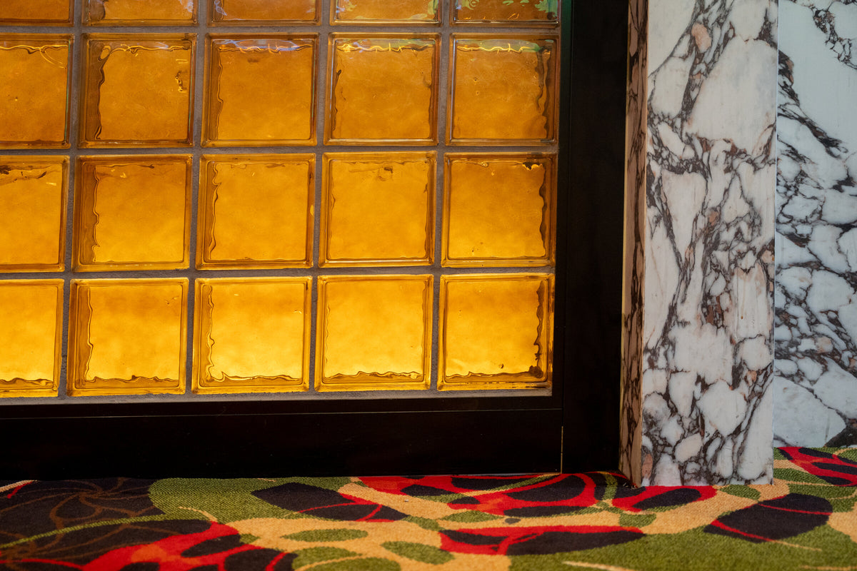 Backlit Square Crystal Brick beside marble