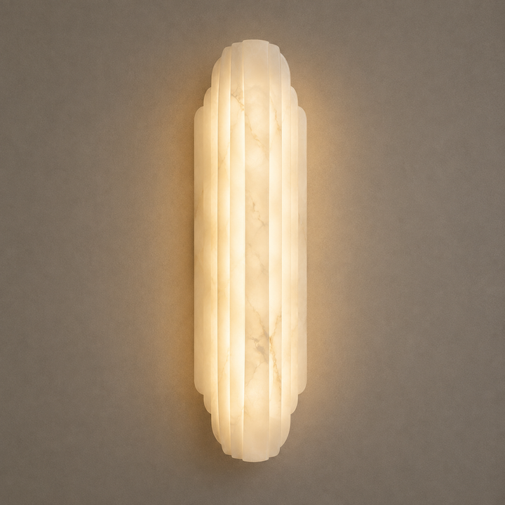 Rivelle Spanish Alabaster Wall Light with fluted natural stone design and warm LED glow