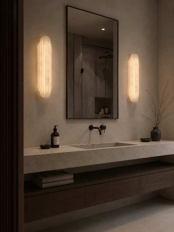 Rivelle Spanish Alabaster Wall Lights beside a bathroom mirror for luxury vanity lighting