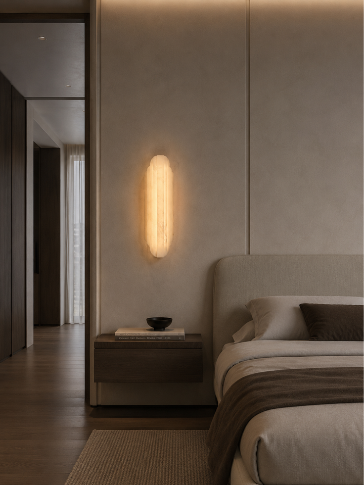 Rivelle Spanish Alabaster Wall Light used as luxury bedside lighting in a modern bedroom