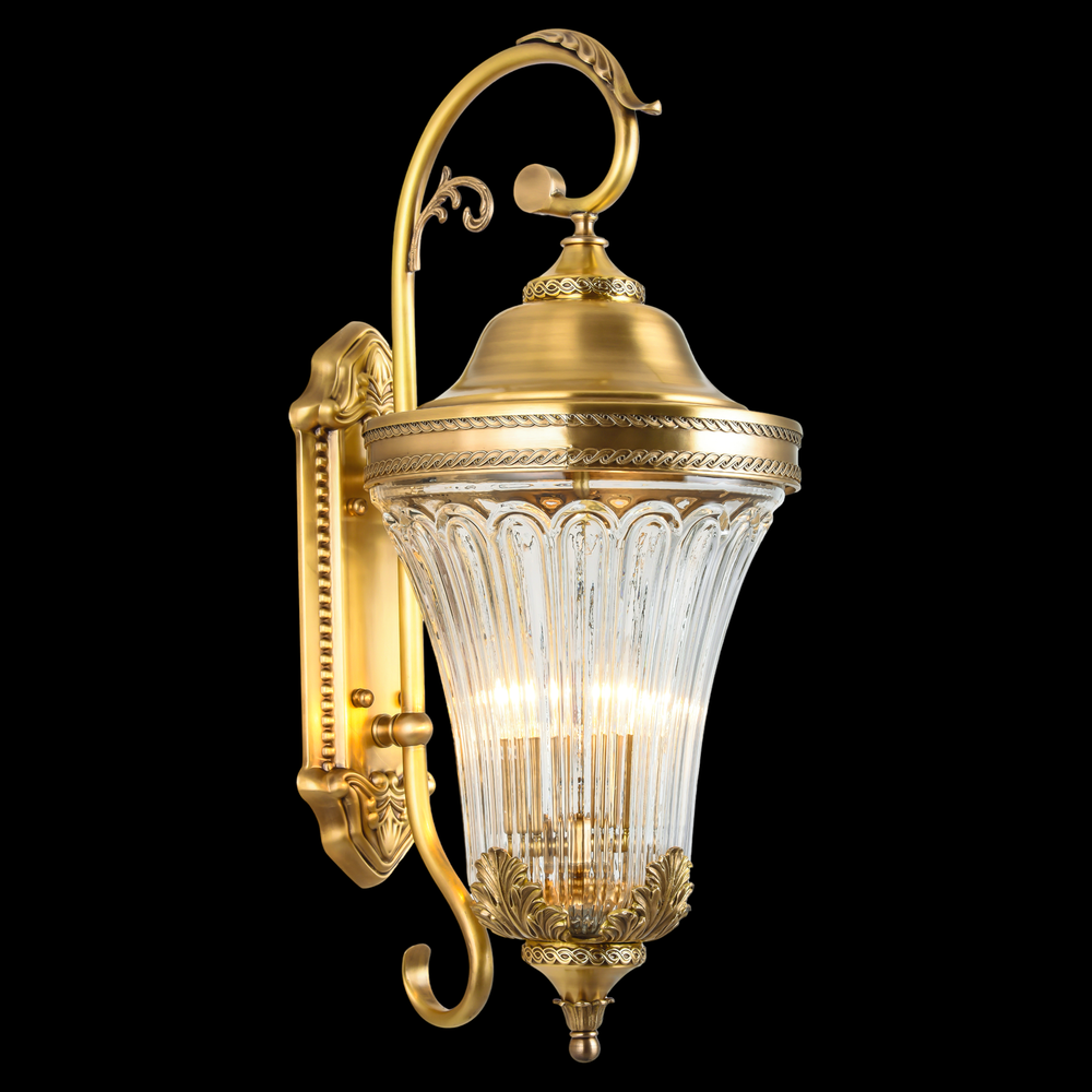 Rococo brass outdoor wall lantern featuring detailed brasswork and a sculpted glass shade in a vintage European design.