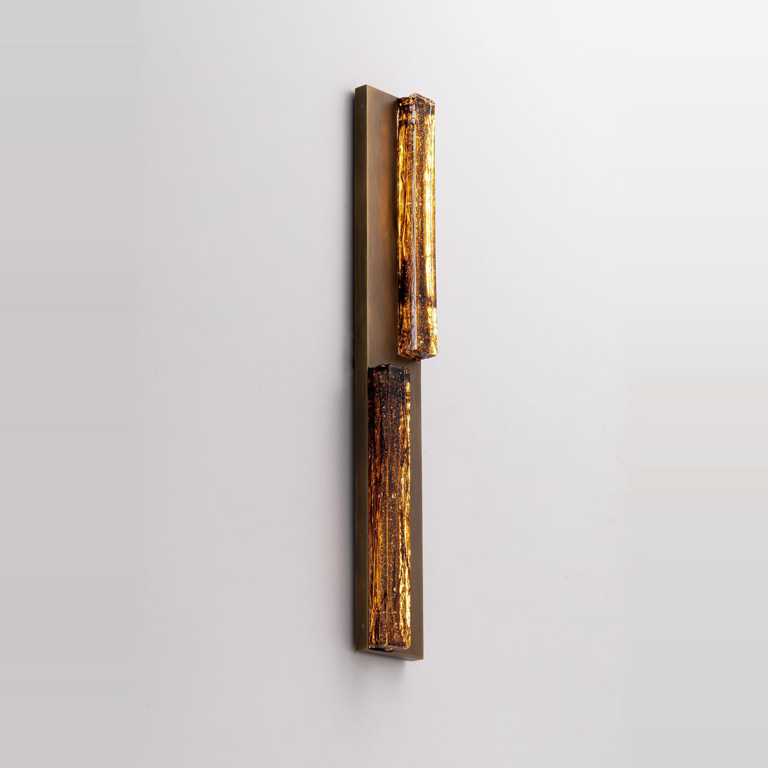 Running Water Duet 1030 modern LED wall light with distressed antique brass finish and illuminated smoked textured glass.