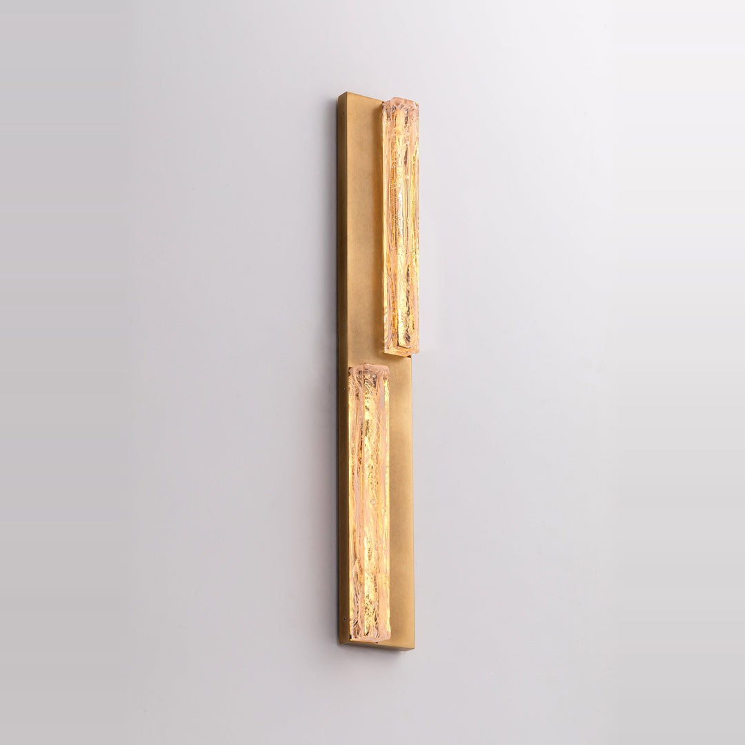 Running Water Duet LED wall light featuring two illuminated textured glass elements on a vertical antique brass backplate.
