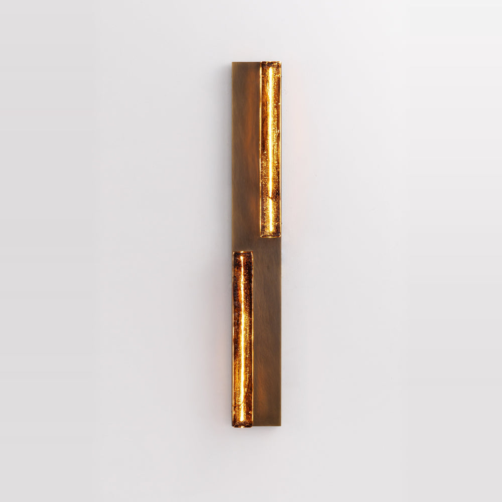 Running Water Duet LED wall light in antique brass with two illuminated textured glass panels.
