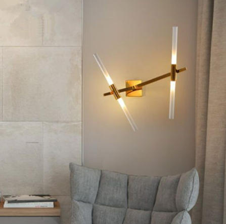 saber 4 wall sconce d brass linear led wall light installed in modern bedroom providing warm ambient accent lighting
