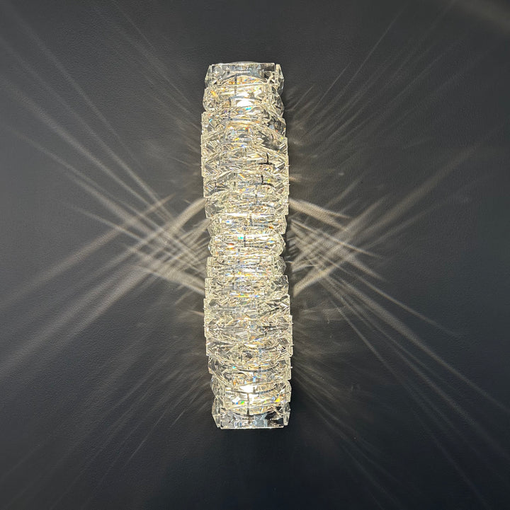 Close-up view of the Savoy Wall Lamp 460 showing its vertical K9 crystal structure, modern wall sconce design, and ambient glow suitable for hallways and bedrooms