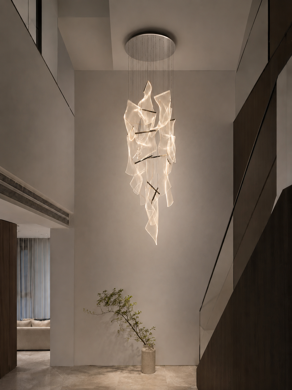 Sculptural German acrylic staircase chandelier in a double-height residential void with minimalist composition and indoor plant, Silken Chandelier 14 by Lucretia