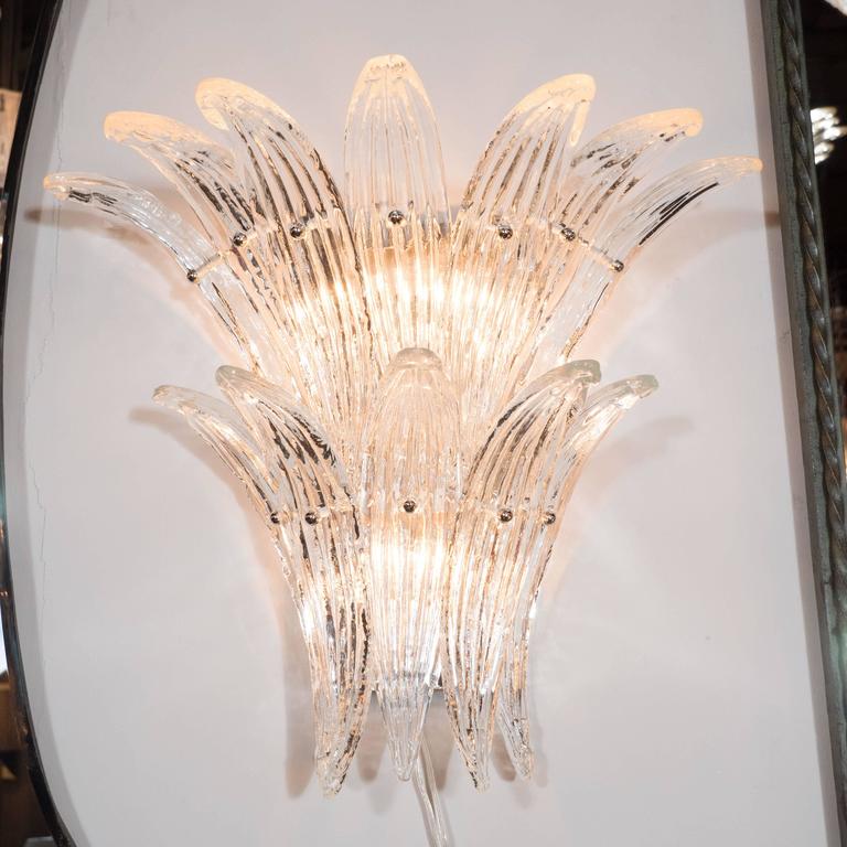 sculptural crystal wall lamp adding luxury ambient illumination in a contemporary hotel or residential space