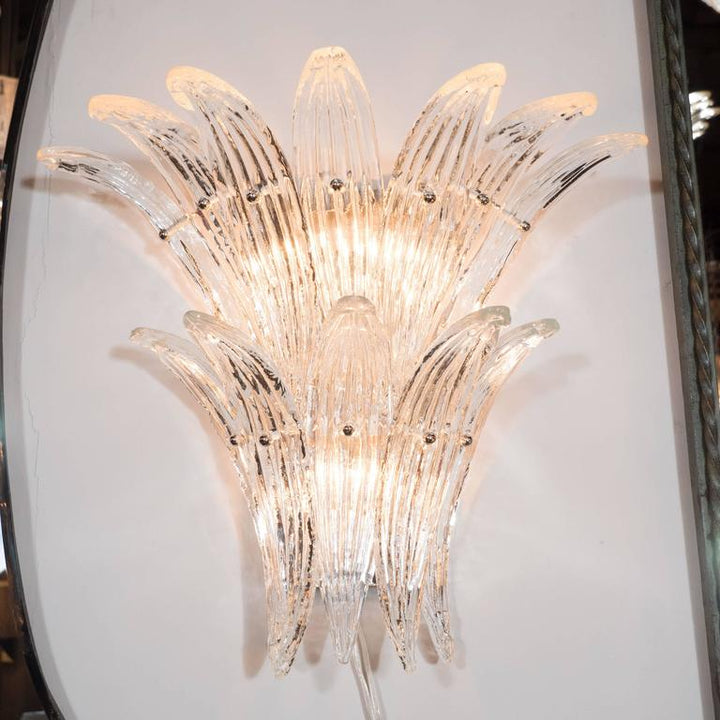 sculptural crystal wall lamp adding luxury ambient illumination in a contemporary hotel or residential space