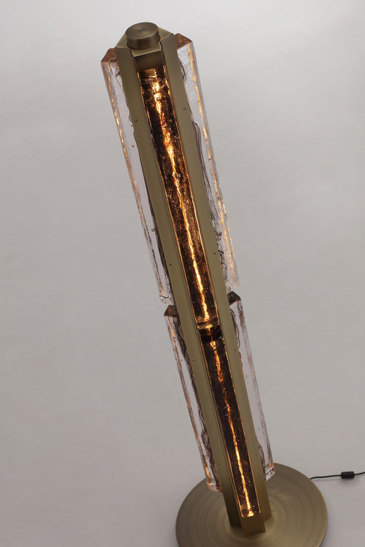 Sculptural designer floor lamp with textured glass and architectural vertical form