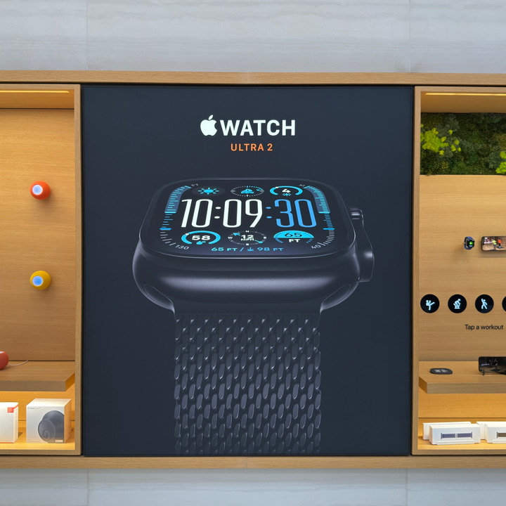 Backlit SEG fabric lightbox used for illuminated advertising graphics in a retail environment.