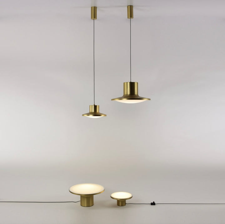 Simbolo lighting series with modern disc-shaped lamps creating a layered lighting effect perfect for residential and commercial interiors.