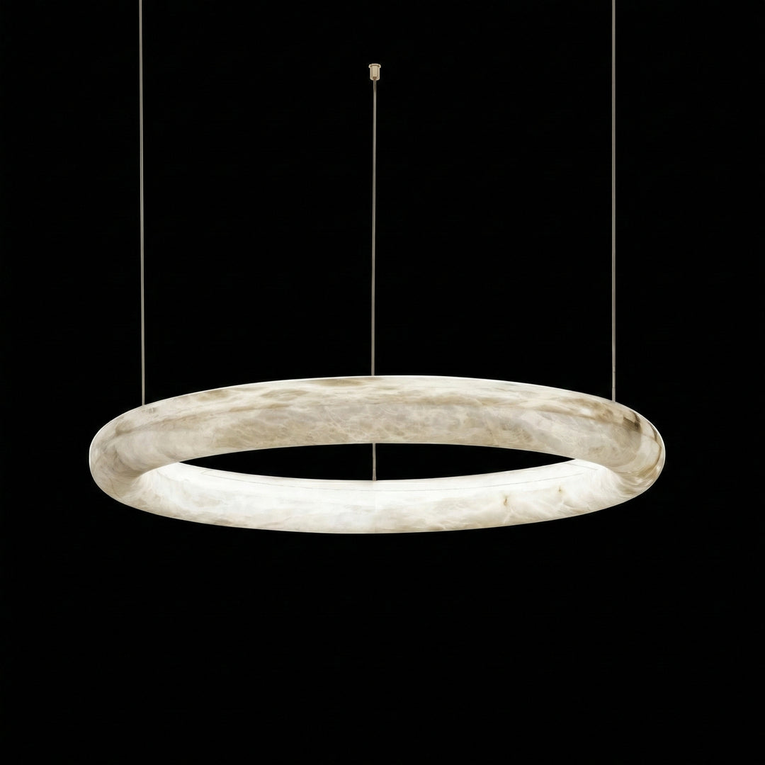 Single ring alabaster pendant light with warm white LED glow isolated on black background – Aurelia