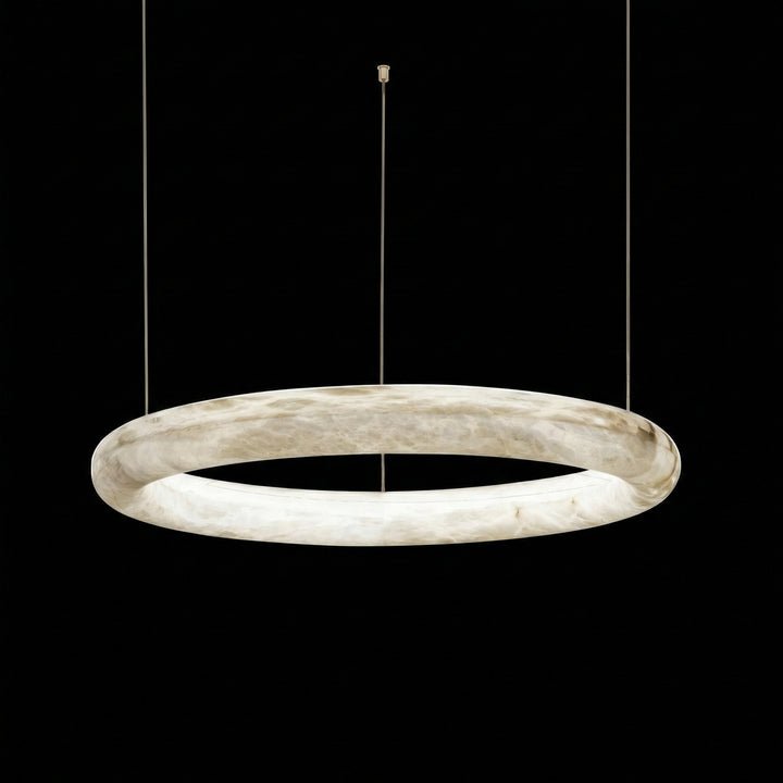 Single ring alabaster pendant light with warm white LED glow isolated on black background – Aurelia