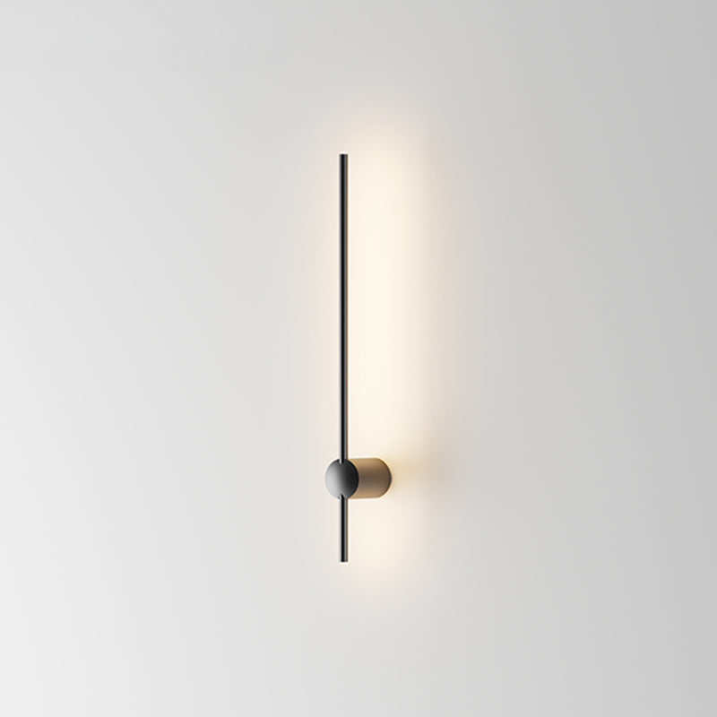 slim modern LED wall lamp mounted on a white wall providing soft indirect indoor wall lighting with a minimalist contemporary wall light design