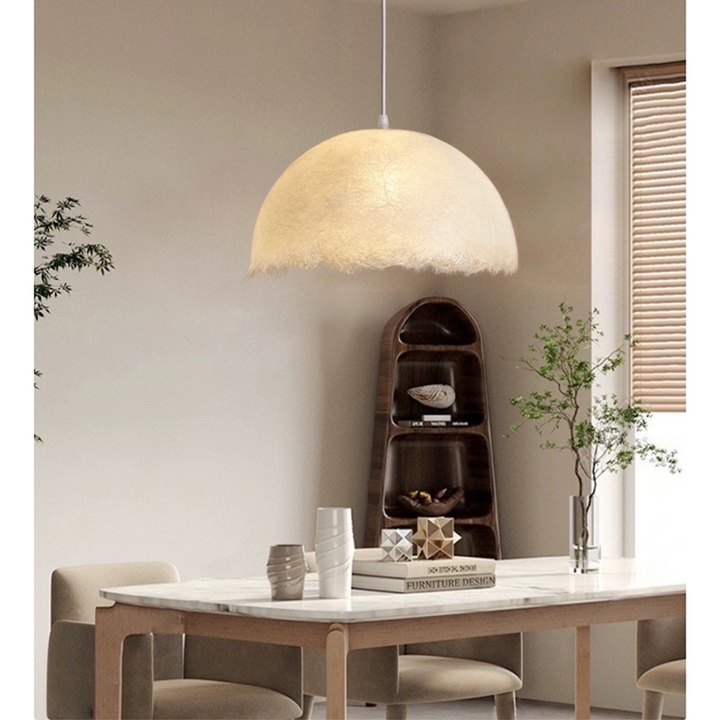 a softly glowing pendant light suspended above a dining table, creating a warm and calming ambient atmosphere within the space