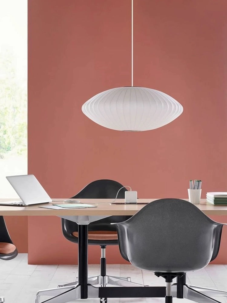 a soft ambient pendant light used in a work and dining area, offering even illumination without glare