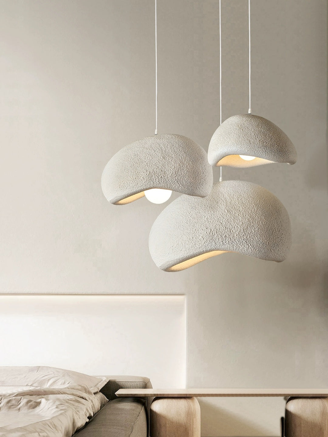 a softly diffused pendant light hanging within an interior space, providing gentle ambient illumination and a quiet visual presence