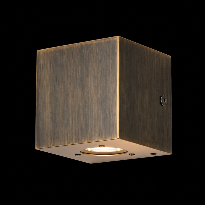 Solid brass bronze cube outdoor wall light with a handcrafted architectural design and IP65 weather-resistant construction.