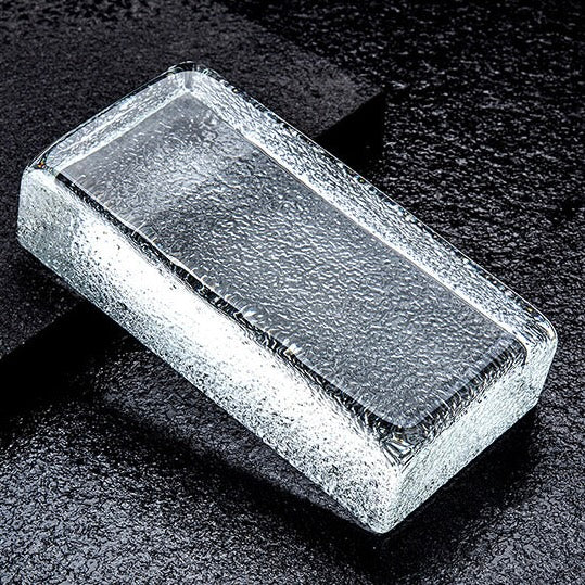 Solid crystal glass brick with fine textured surface for decorative wall applications