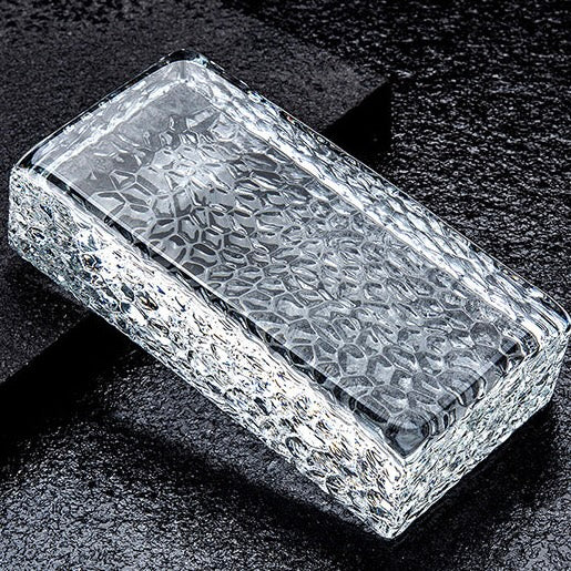 Solid crystal brick glass block showing refined texture and light refraction