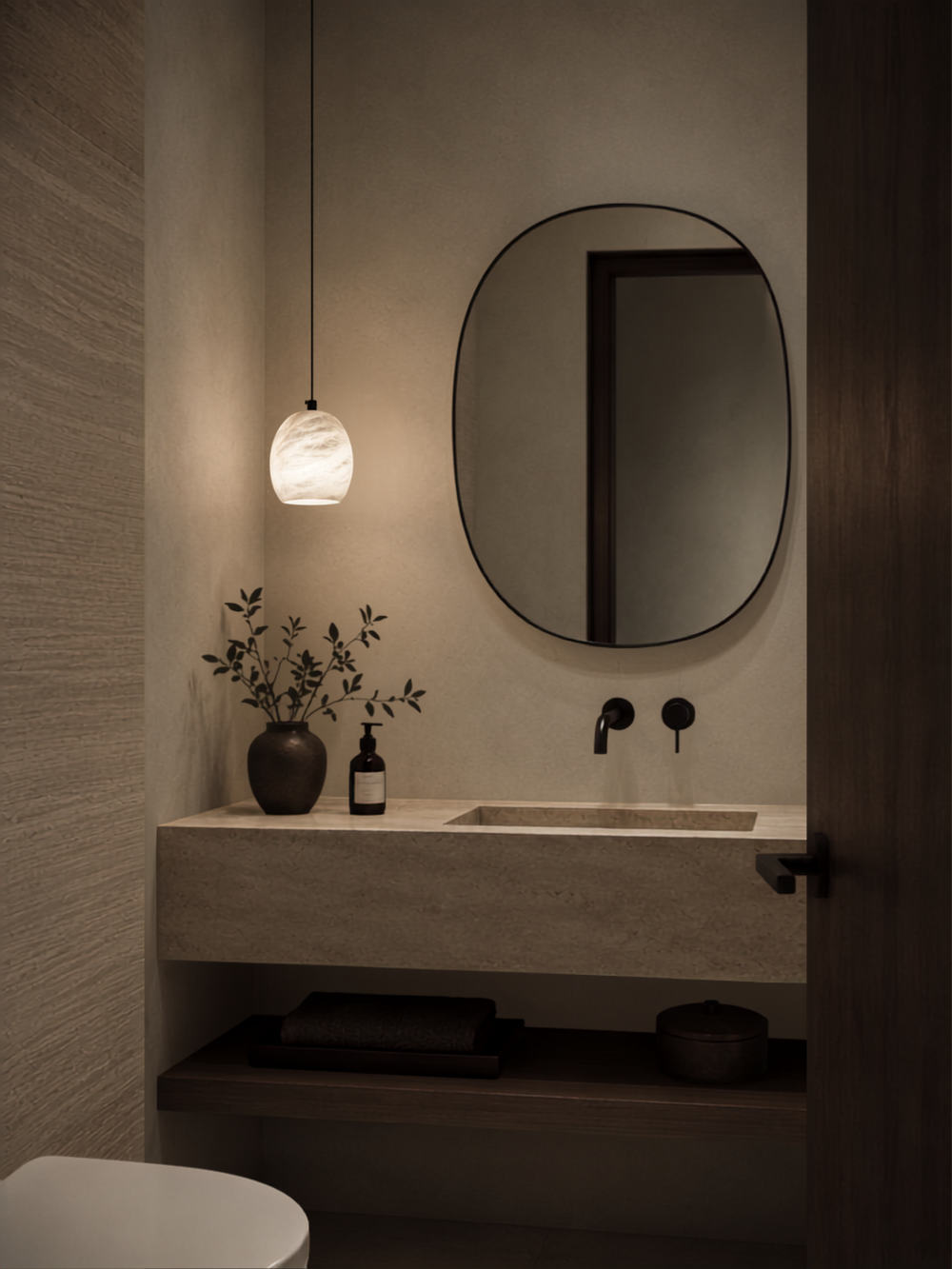 Ovela Spanish alabaster pendant light beside a bathroom vanity mirror with warm ambient lighting