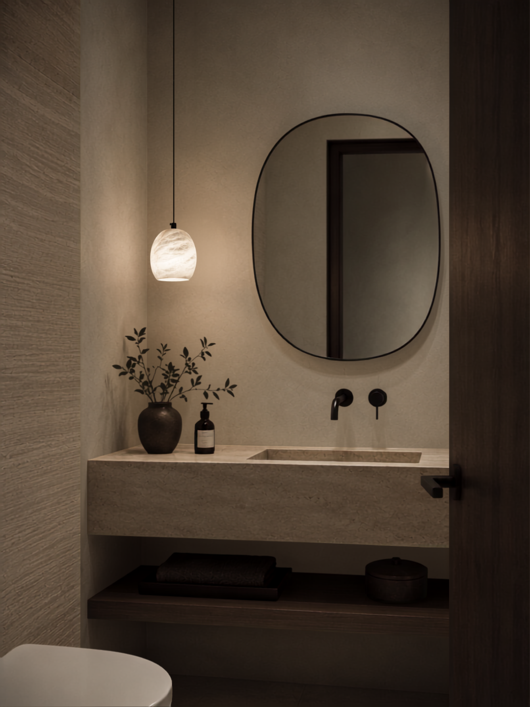 Ovela Spanish alabaster pendant light beside a bathroom vanity mirror with warm ambient lighting