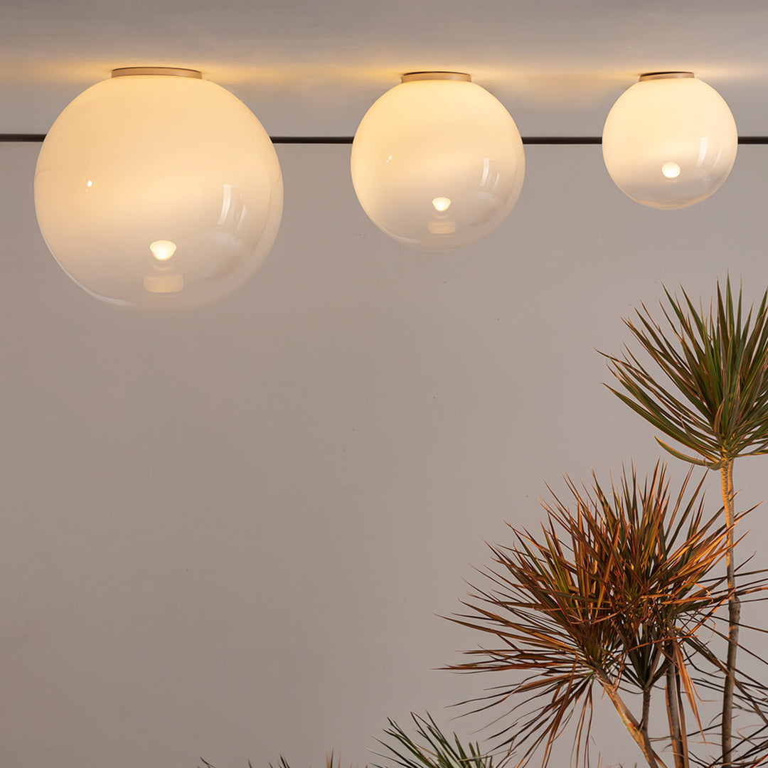 Sphere glass ceiling light in modern interior with warm diffused lighting