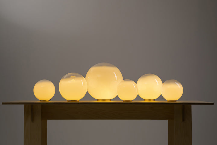 Sphere glass lights arranged in commercial ceiling feature installation