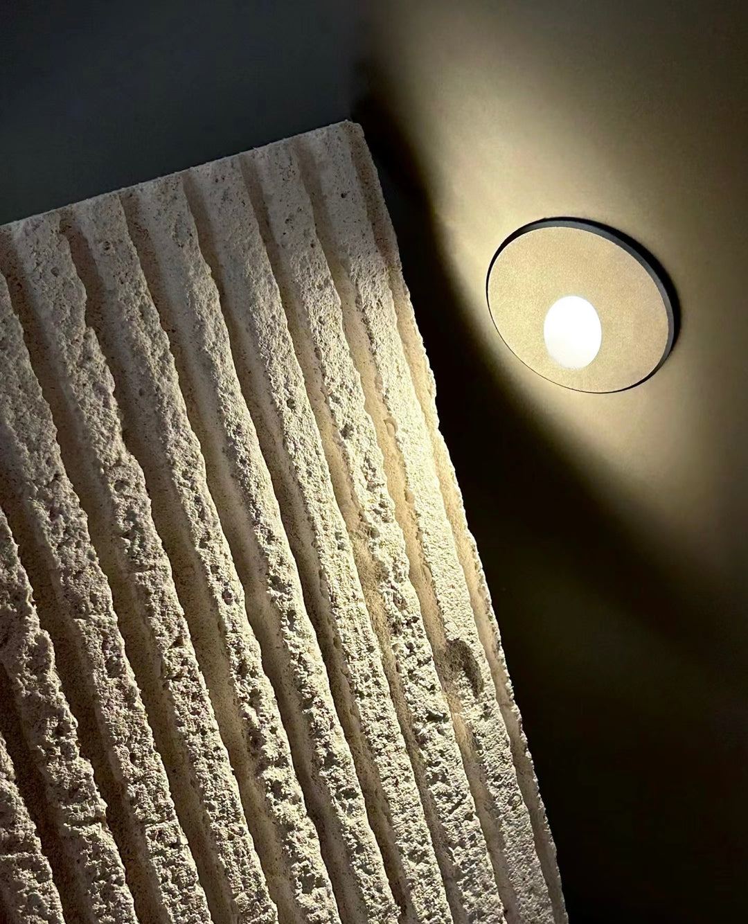 Square Line Stone textured wall panel with architectural lighting enhancing stone texture depth