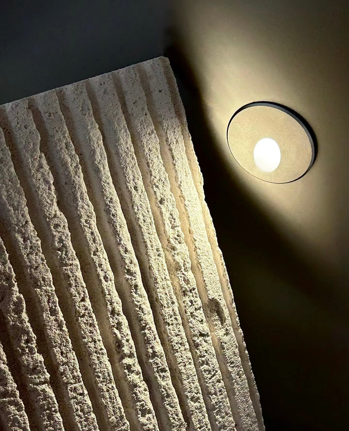 Square Line Stone textured wall panel with architectural lighting enhancing stone texture depth