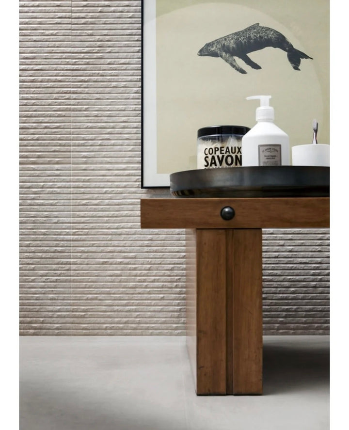 Stone textured feature wall using round line stone panels in a contemporary residential interior.