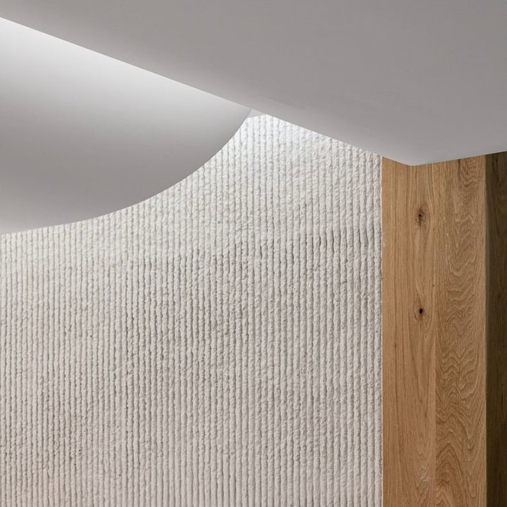 Stone textured wall panels with round line stone finish used on a modern interior feature wall.