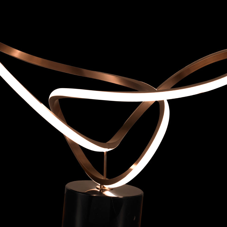 Detail view of Tallis LED table lamp showing metallic structure and integrated warm LED strip, suited for modern interior styling.