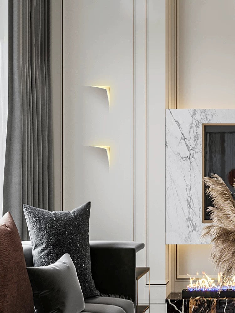 tear shaped gypsum LED wall light illuminating a modern living room with soft ambient wall lighting