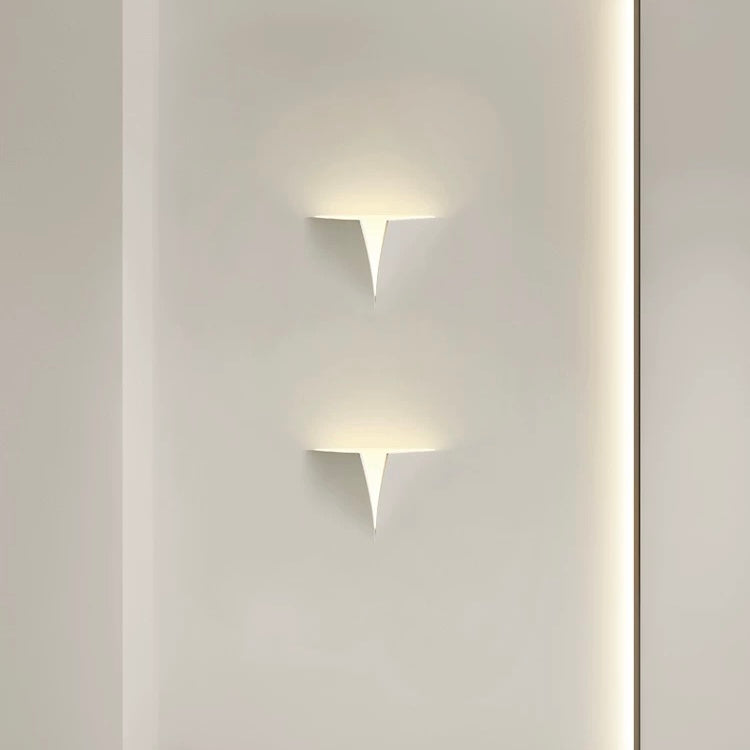 tessera gypsum LED wall light providing soft indirect ambient lighting on a minimalist interior wall