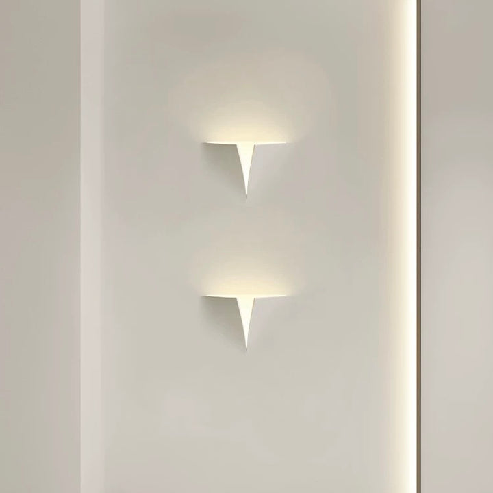 tessera gypsum LED wall light providing soft indirect ambient lighting on a minimalist interior wall
