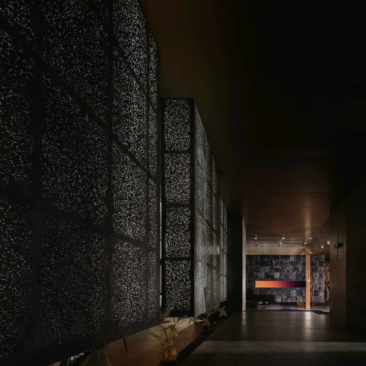 Translucent aluminium foam wall panels installed along a corridor for architectural lighting design