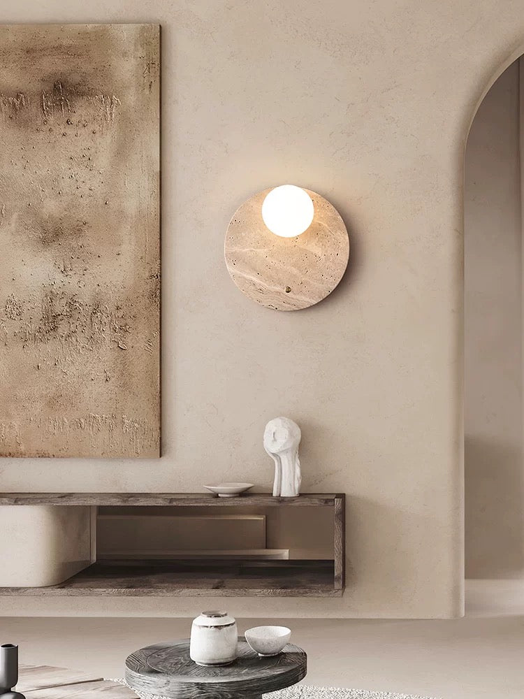 travertineglow 250 stone wall light installed in a contemporary bathroom creating natural warm ambient illumination