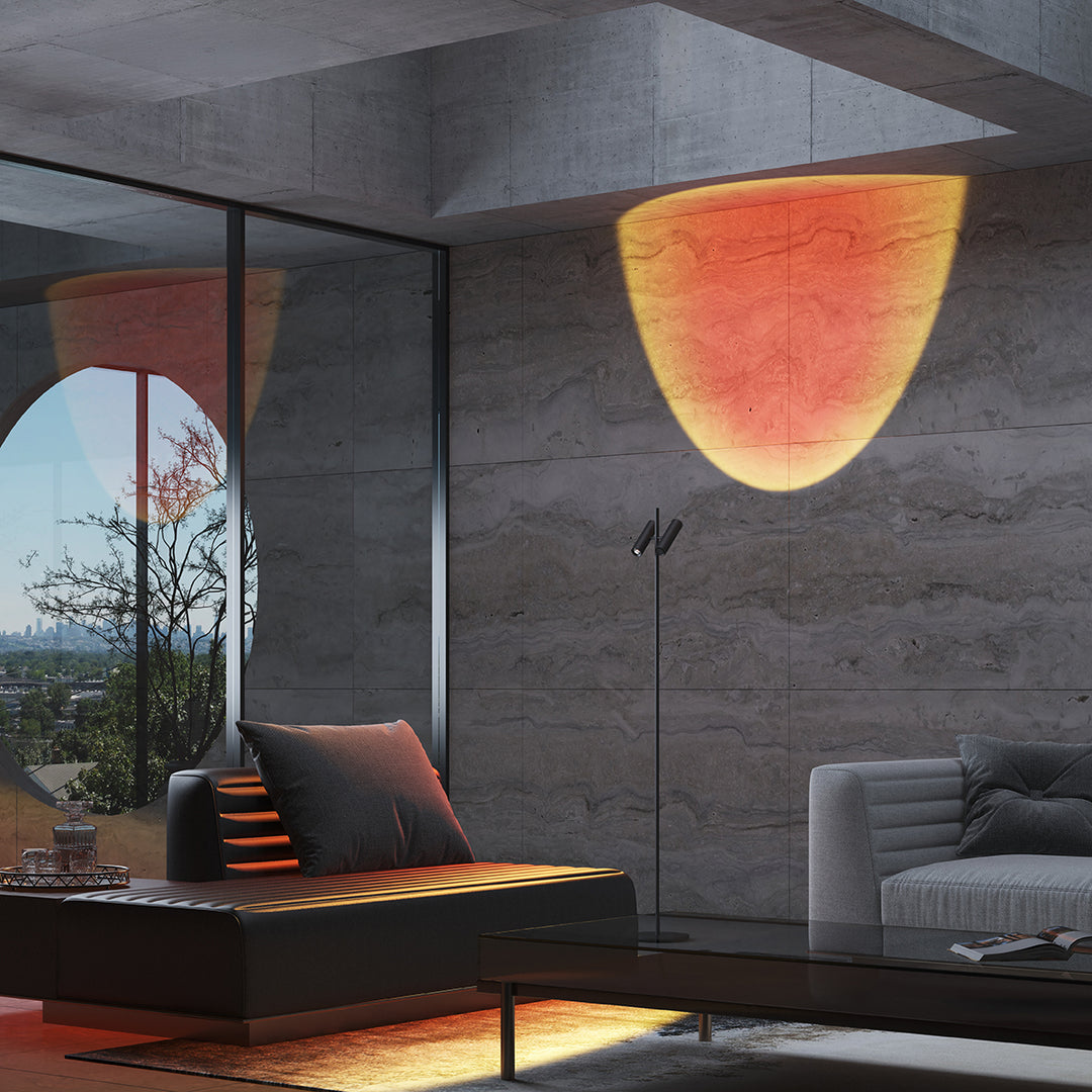 Double-head Twilight floor lamp in sunset red mode projecting warm wall wash lighting in a modern living room.