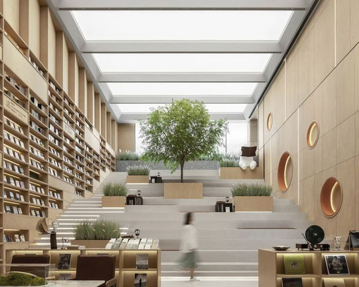 LED stretch ceiling panels illuminating a modern cultural library space with tiered seating, natural light effect and contemporary architectural design.