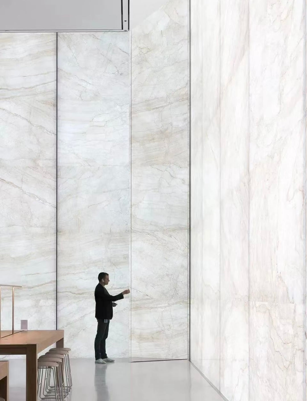 Ultra-thin marble stone wall panels installed as a large-scale feature wall in a modern interior