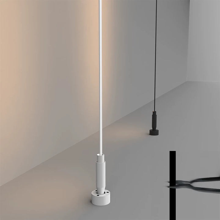 vertical linear LED light providing soft ambient illumination in a minimalist modern interior