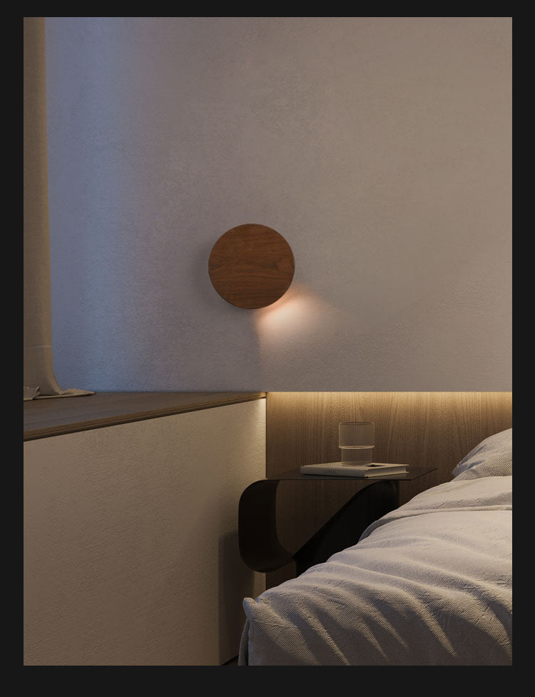 walnut wood led wall lamp illuminating a scandinavian style bedroom bedside wall