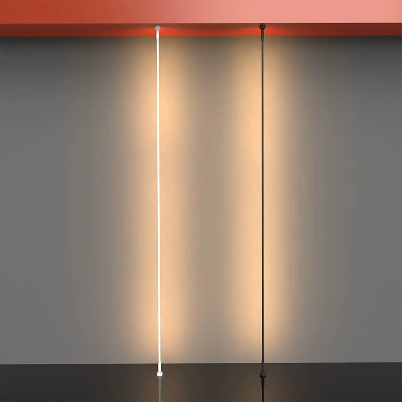 warm linear LED light used as a wall washer creating ambient architectural lighting on a textured interior wall