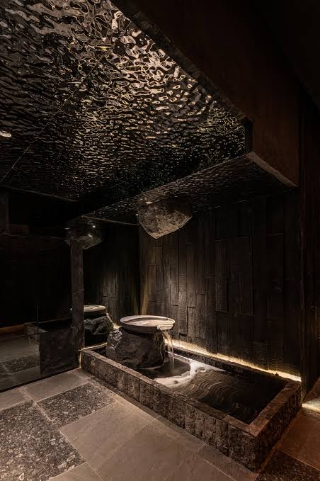 WaveForm 304 stainless steel panel used as a textured ceiling feature in a modern bathroom interior