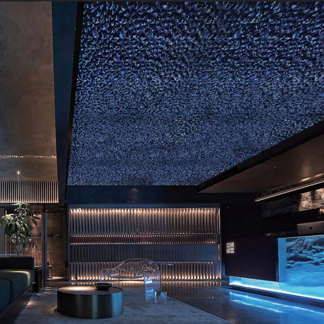 WaveForm 304 stainless steel ceiling panel with textured wave pattern and blue ambient lighting in a modern interior