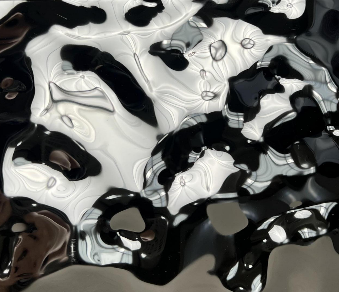 Close up detail of WaveForm 304 stainless steel panel showing the textured wave metal surface